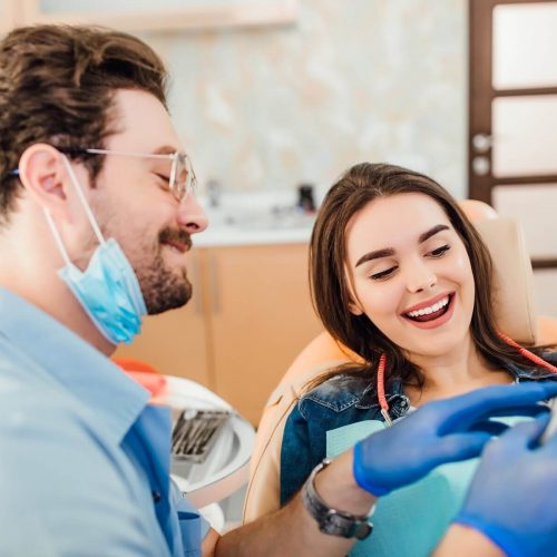 dentist-matching-colour-tooth-enamel-with-whitening-chart_496169-964 (1)